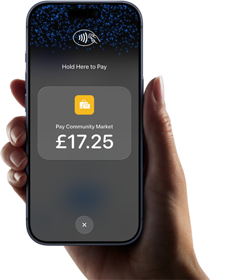 Right hand holding iPhone with display showing specific amount to be paid and instructions on how to contactlessly pay when ready