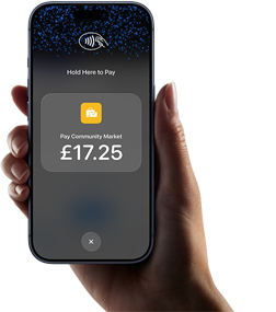 Right hand holding iPhone with display showing specific amount to be paid and instructions on how to contactlessly pay when ready