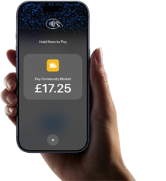 Right hand holding iPhone with display showing specific amount to be paid and instructions on how to contactlessly pay when ready