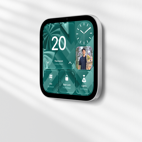Apple HomeView wall-mounted model on a wall, silver colour, displaying time, temperature, and controls for thermostat, bedroom fan, door lock and lights
