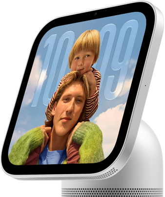 Apple HomeView, silver colour, side exterior, semi-transparent time of day displayed on an image of a person carrying a child on shoulders, both looking forward