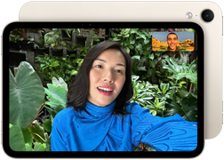 iPad mini, front view, displaying a Landscape 12MP Center Stage front camera interface, showing a person video calling amidst green foliage