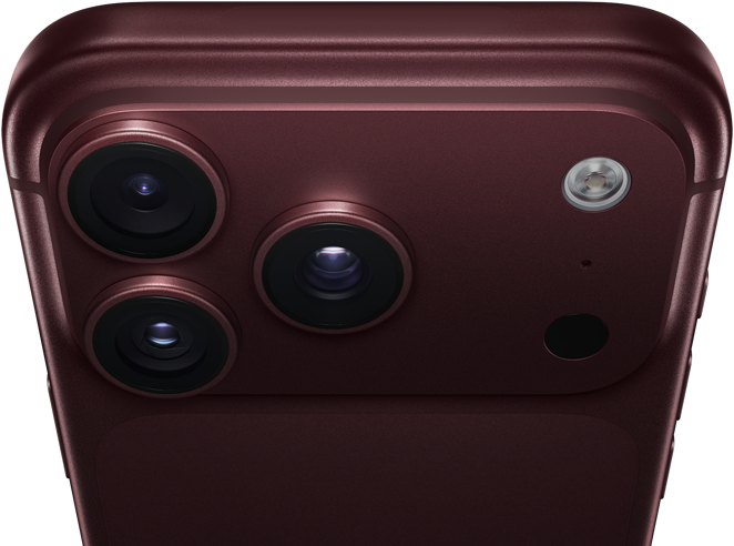 iPhone 18 Pro Max, burgundy colour (dark red), back exterior, Pro Fusion camera system at top, 3 lenses, variable aperture blades partially closed, flash, microphone and LiDAR scanner, top exterior, mobile antenna, flat sides, rounded edges
