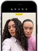 iPhone 18 Pro, black, front exterior, displaying two models posing for the camera, demonstrating the Center Stage front camera