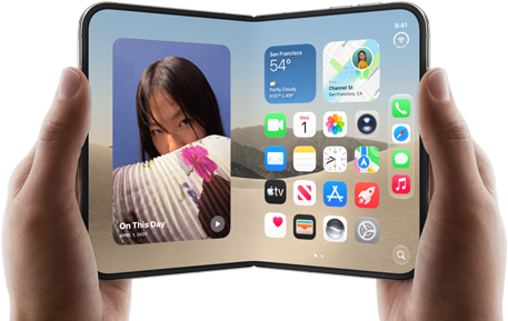 iPhone Duo, Star White colour, held by two hands in landscape orientation, unfolded, interior screen displays photos on the left, apps on the right
