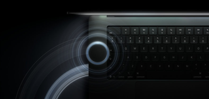 MacBook Pro with PROLED XDR Display, open lid, space black colour, keyboard lit by glow from display, circles depicting sonic waves emanate from top and left side of laptop body