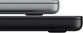 14-inch MacBook Pro with PROLED XDR Display, silver colour, stacked on top of 16-inch model, space black colour, showing size difference